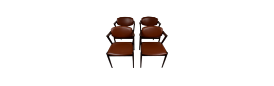 A set of four rosewood armchairs by Kai Kristiansen