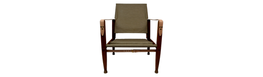 Canvas upholstery and full grain leather straps for the Kaare Klint safari chair
