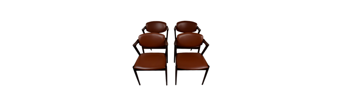 A set of four rosewood armchairs by Kai Kristiansen